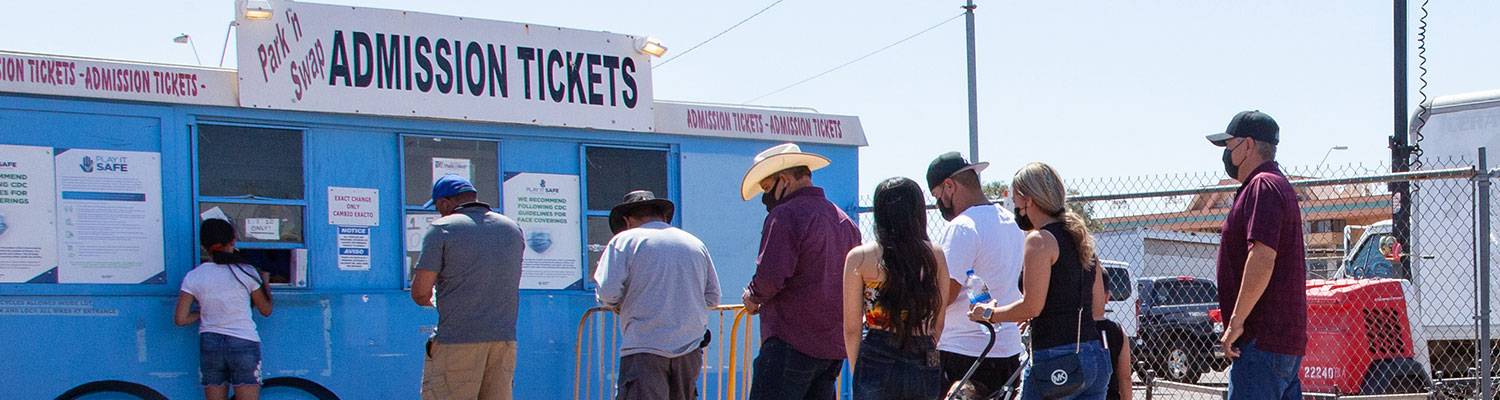 Line of people in front of Admission Tickets booth