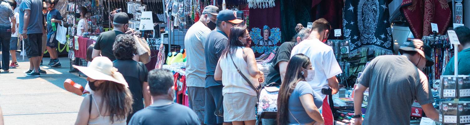 Crowds of people shopping at outdoor vendors