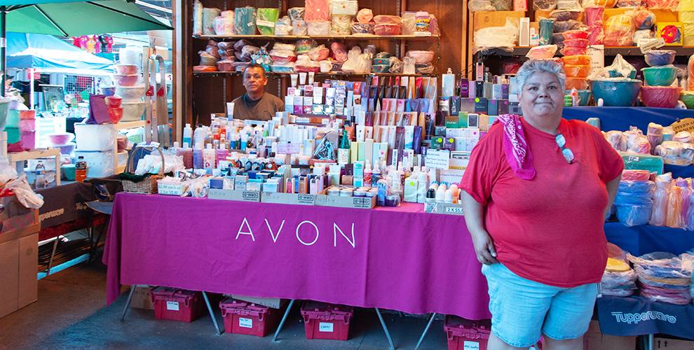 Woman standing in front of cosmetics table