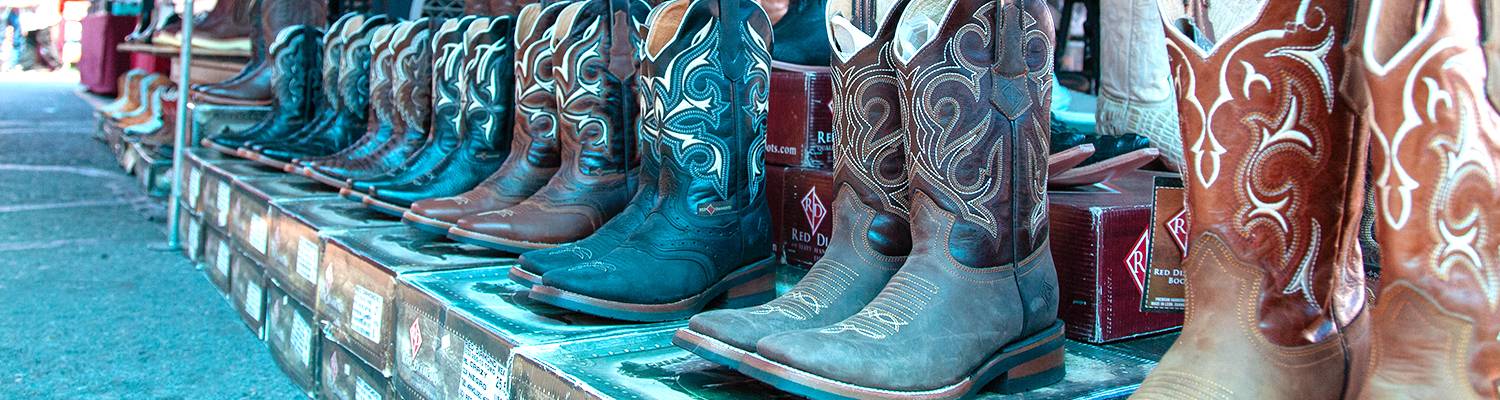 Outdoor vendor selling boots & shoes